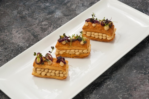 Puff pastry appetizer with chicken pate and caramelized onions