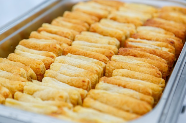 puff pastry buns in metal container