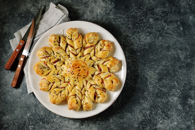 Puff pastry pie with ham and cheese