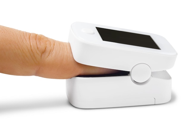 Pulse oximeter on finger on white background