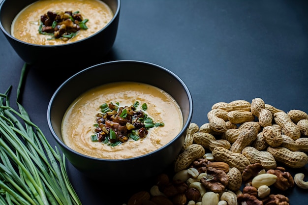 Pumpkin cream soup. Dark background.