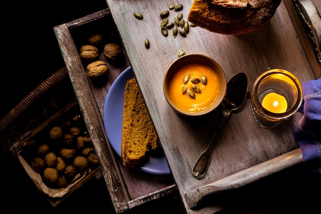 Pumpkin cream soup with homemade bread