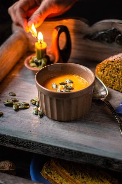 Pumpkin cream soup with homemade bread