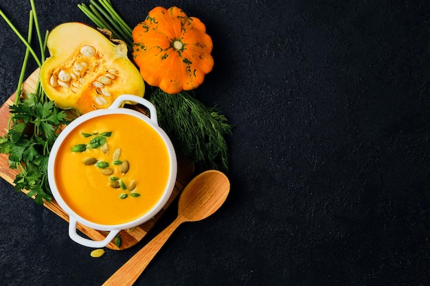 Pumpkin cream soup with pumpkin seeds served