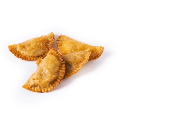 Pumpkin empanadillas isolated on white background.