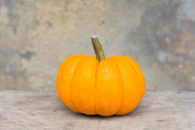 Pumpkin on old wall