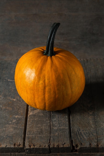 Pumpkin orange on wooden boards for halloween holiday