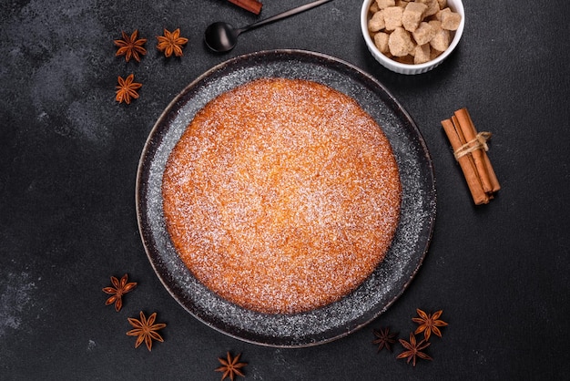 Pumpkin pie on marble cutting board Dark background Copy space