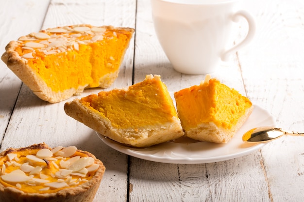 Pumpkin pie with almond slices