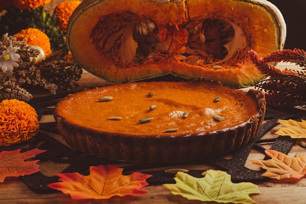 Pumpkin pie on wooden table. Dessert for thanksgiving dinner and pumpkin on wooden table.