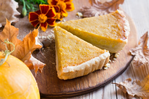 Pumpkin pie on wooden table