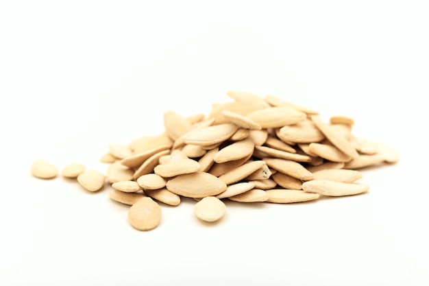 Pumpkin seeds on white background