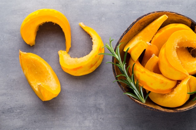 Pumpkin slices on the gray background.