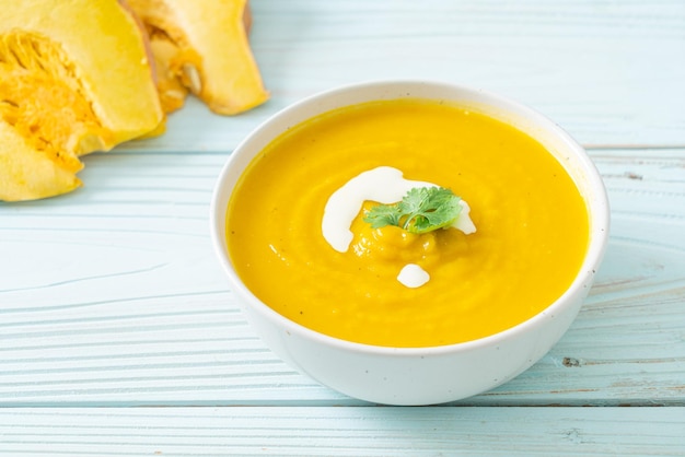 pumpkin soup in white bowl