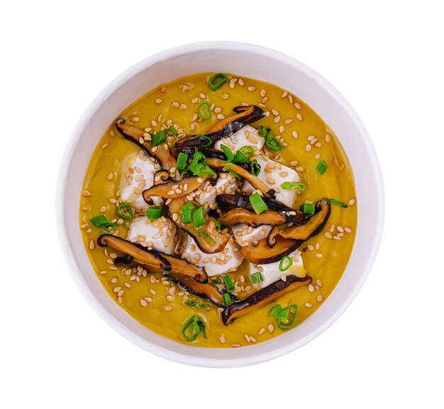 Pumpkin soup with mushrooms sour cream and herbs and mozzarella