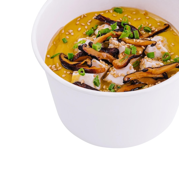 Pumpkin soup with mushrooms sour cream and herbs and mozzarella