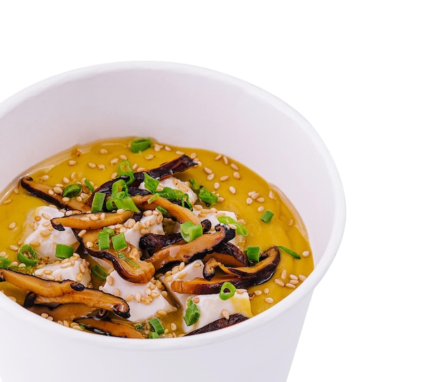 Pumpkin soup with mushrooms sour cream and herbs and mozzarella