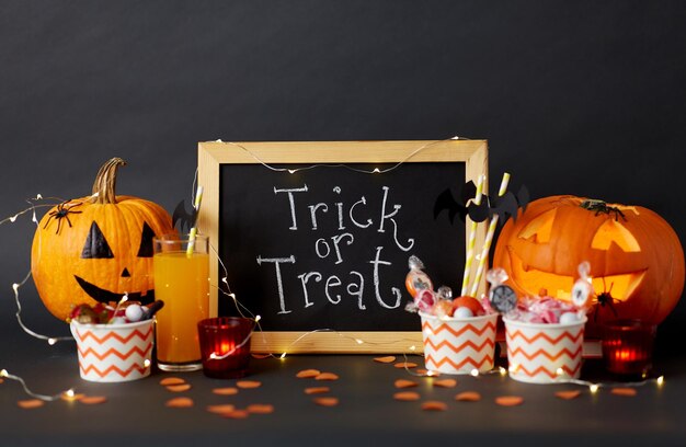 Photo pumpkins candies and halloween decorations