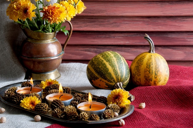 Pumpkins,copper jug with yellow chrysanthemums 