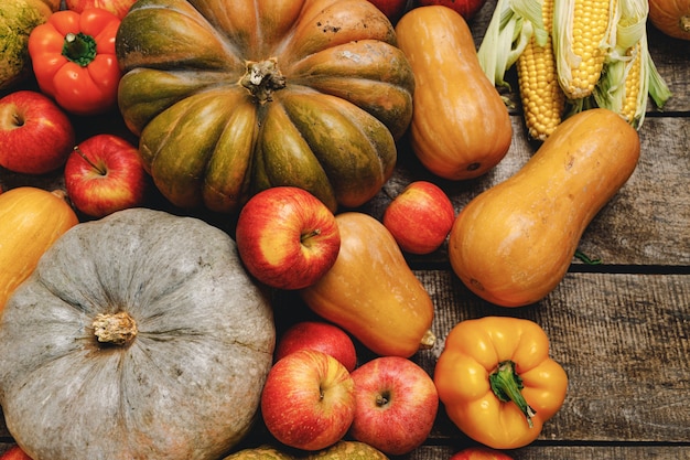 Pumpkins and red apples