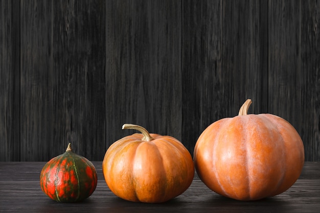 Pumpkins on weathered rustic wood table