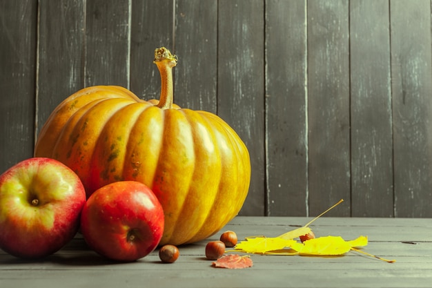 Pumpkins on wooden board