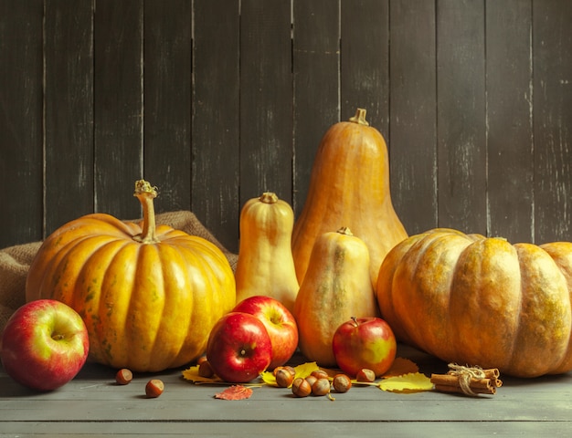 Pumpkins on wooden board