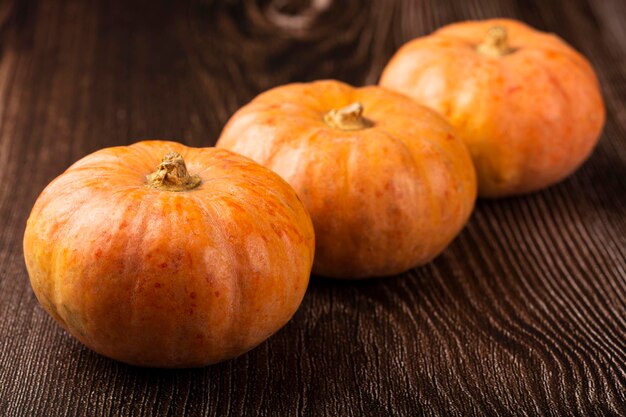 Pumpkins on the wooden table