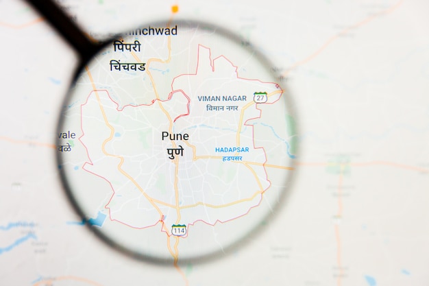 Pune city visualization illustrative concept on display screen through magnifying glass