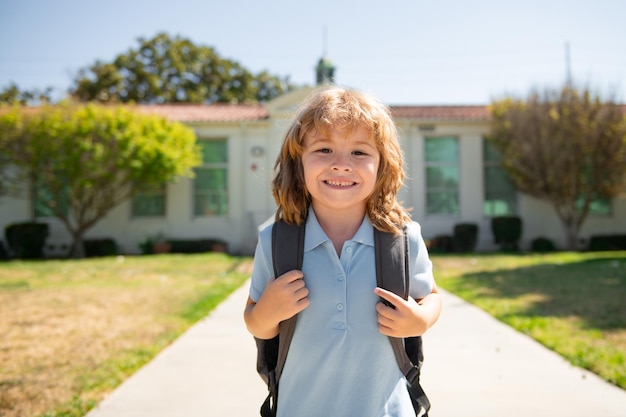 Pupil go study with backpack. Funny school boy face. Schoolchild running on playground ta end of class. School vocation. Go to school.