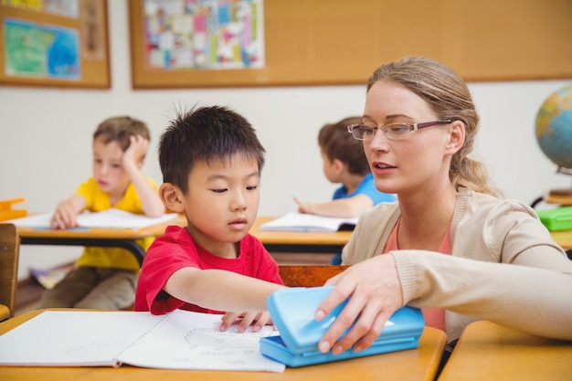 Pupil taking a pen in his pencil case