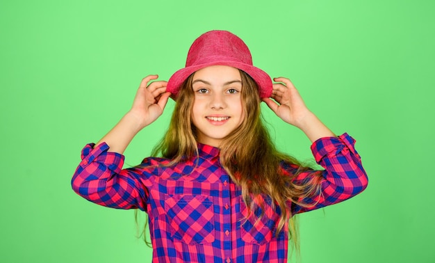 Pure beauty. checkered fashion for teen. happy childhood concept. small girl follow latest trends. pure and natural beauty. child has long hair. hipster girl wear retro hat. stylish kid looking retro.