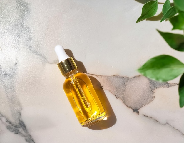 Pure Elegance Aromatherapy Serum in Glass Bottle on Marble Background Natural Cosmetic Concept