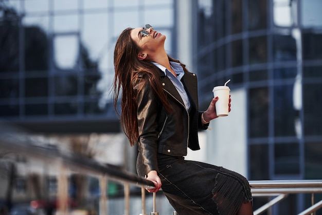 Pure happiness. Young beautiful girl in warm clothes have walk in the city at her weekends time