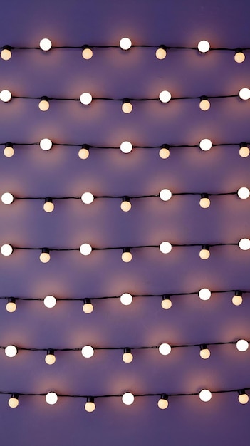 Photo a purple background with a pattern of lights and a white border