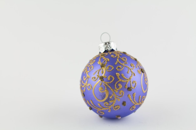 Purple ball for christmas tree on white background