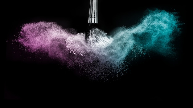 Purple and blue ocean powder color splash and brush for makeup artist