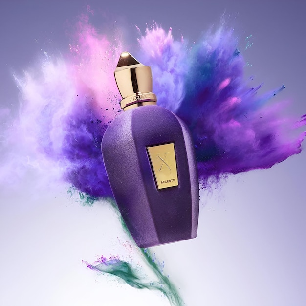 a purple bottle of perfume with a gold label on it