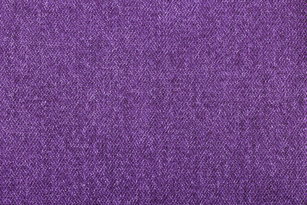 purple color jeans texture factory fabric on white background close up