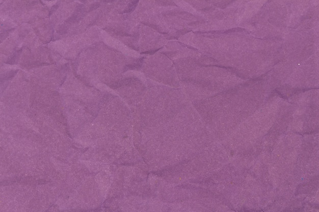 Purple crumpled paper texture background