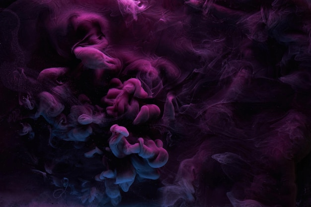 Purple dark abstract background luxury colored smoke acrylic paint underwater explosion cosmic swirling ink