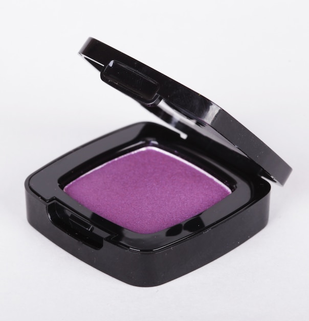 Purple eye shadows over white background