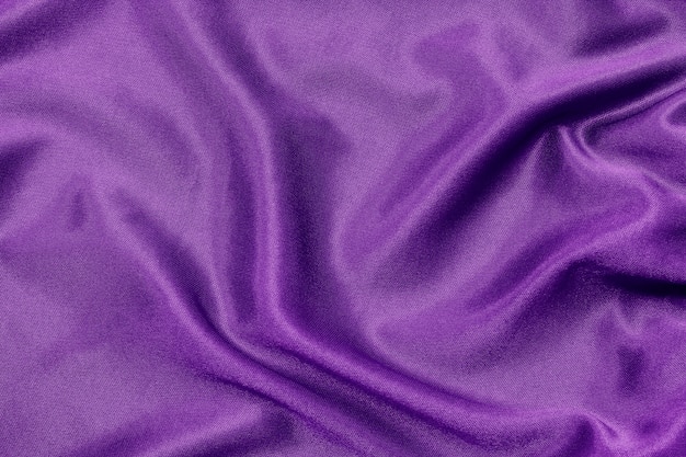 Purple fabric texture for background and design, beautiful silk or linen.