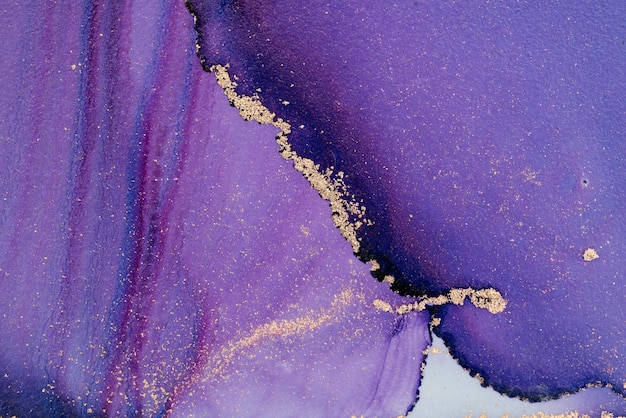 A purple and gold painting with gold paint and a gold foil.