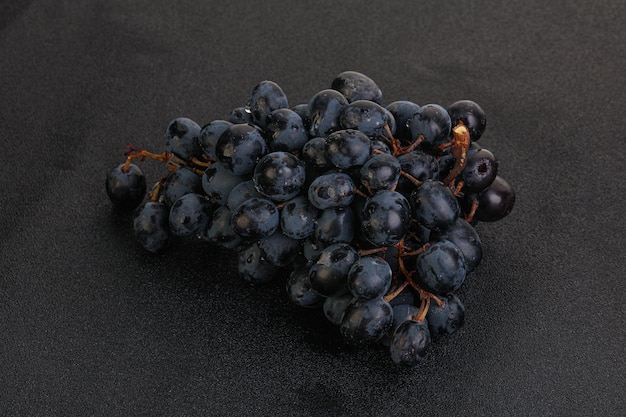 Purple grape branch over background