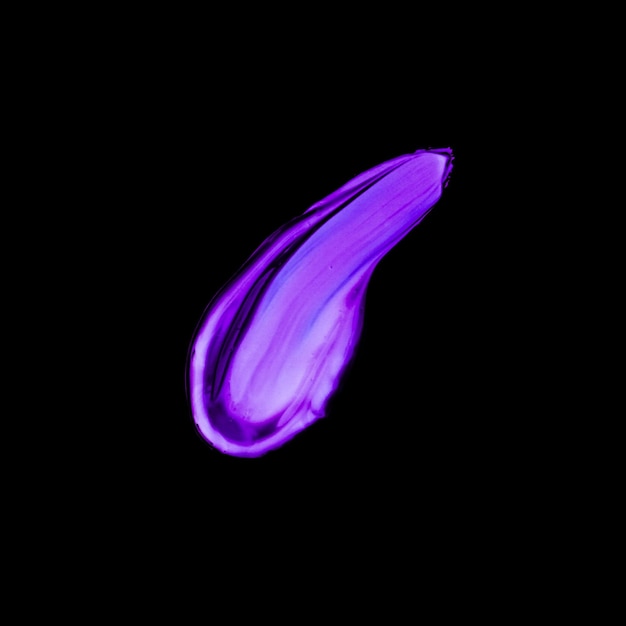 Purple neon paint brush stroke texture isolated on black background