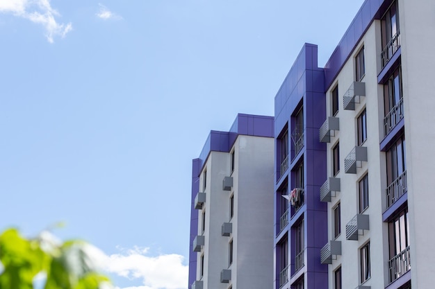 Purple new houses on sky background