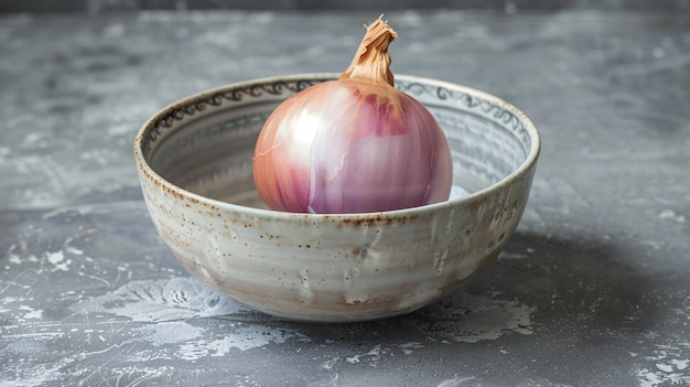 Photo a purple onion is in a bowl with a white and gold design