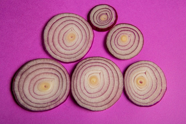 Purple onion on purple color background