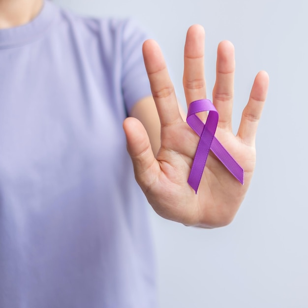 Purple Ribbon for Violence Pancreatic Esophageal Testicular cancer Alzheimer epilepsy lupus Sarcoidosis and Fibromyalgia Awareness month and World cancer day concept